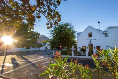 a view of a street with a white building at De Hoek Manor in Stellenbosch