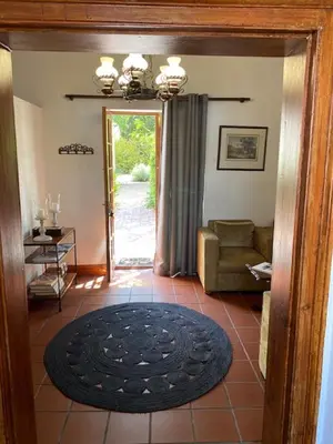 a living room with a couch and a rug at The Prime Spot Self Catering in Worcester