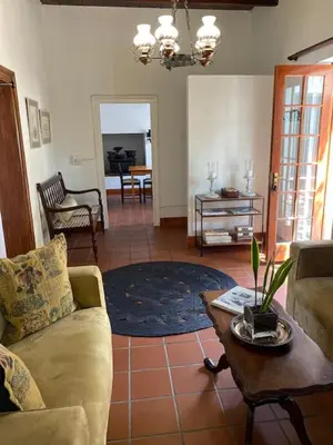 a living room with a couch and a table at The Prime Spot Self Catering in Worcester