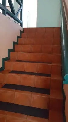 a set of stairs in a building with brown at Durbanville Place - 3 bedroom apartment in Durbanville
