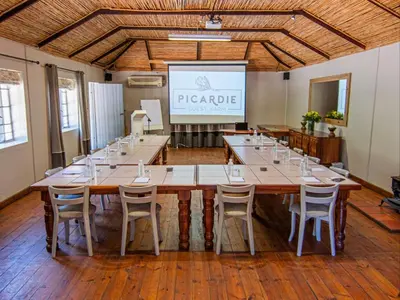 a large conference room with a large table and chairs at Picardie Guest Farm in Paarl