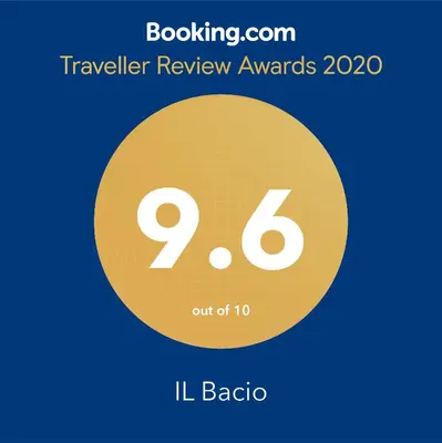 a sign that reads traveler review awards with a yellow circle at Posto Al Sole - IL Bacio in Bellville