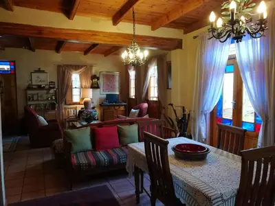 a living room with a table and a couch at Die Heemhuis in Rawsonville