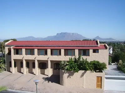 a house with a mountain in the background at Ramasibi Guest Services in Panorama