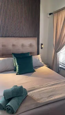 a bed with two pillows on top of it at Panorama Self Catering 2 in Panorama
