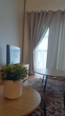 a living room with a table and a potted plant at Panorama Self Catering 2 in Panorama