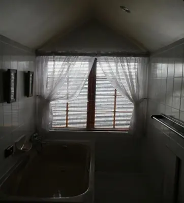a bathroom with a window and a bath tub at Panorama Self Catering 2 in Panorama