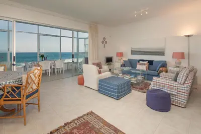 a living room with a view of the ocean at Jewel of Bayview in Hermanus