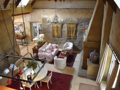 an overhead view of a living room with a chandelier at Franschhoek Rose Cottages in Franschhoek