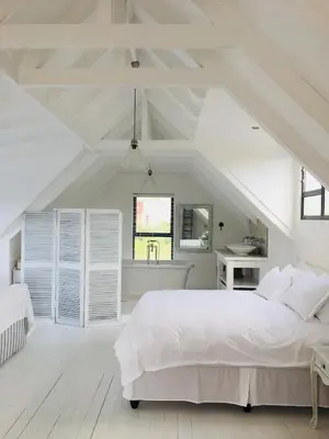 a white bedroom with a large bed and a sink at Pringle @ 865 Jally in Pringle Bay