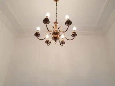 a chandelier hanging from a ceiling in a room at Fama Lodge Single Rooms in Cape Town