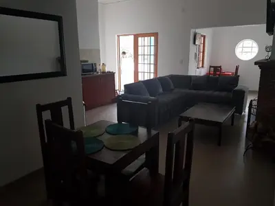 a living room with a couch and a table at Fama Lodge Single Rooms in Cape Town