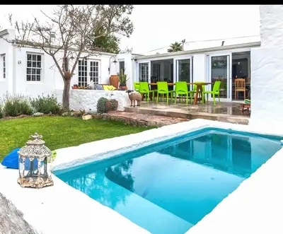 a swimming pool in the backyard of a house at De Kale Kat in Greyton