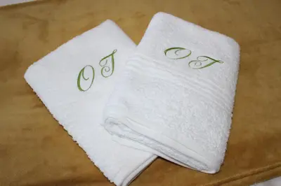 two towels on a table with the word god on them at Amru Guesthouse B&B in Brackenfell