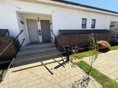 a stairway leading to a white building at Middelplaas Paarl Guesthouse in Paarl