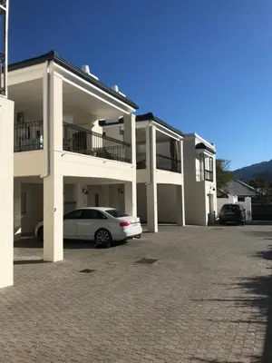a car parked in a parking lot in front of a building at Maison Malherbe in Franschhoek