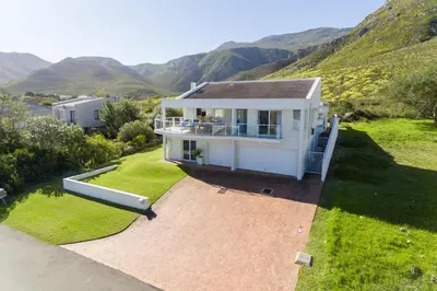 an aerial view of a house with mountains in the background at 42 on 4th in Hermanus