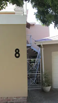 a building with a number on the side of it at Pinewoods Rest in Somerset West