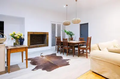 a living room with a couch and a table and chairs at De Hoop Farm - Mountain View in Breerivier