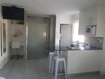 a kitchen with a counter and a counter top at Alyssa's Inn Boutique Guesthouse in Cape Town