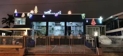 a restaurant with christmas lights on the front of it at Tranquility in Parow