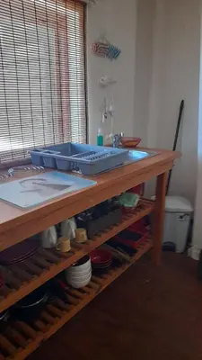 a sink sitting on top of a wooden table at Oak on Blair in Somerset West