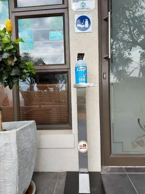 a bottle of water sitting in front of a door at Tyger Hills Guest House in Bellville