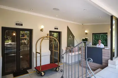 a woman is standing in theoyer of a house at Alluvia Boutique Winery & Luxury Accommodation in Stellenbosch