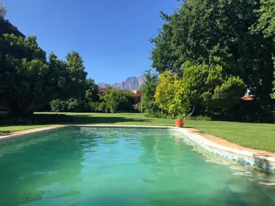 a swimming pool in a yard with trees at Becketts Bliss in Worcester