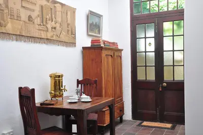 a room with a wooden table and a door at Mooiplaas Wine Estate in Stellenbosch