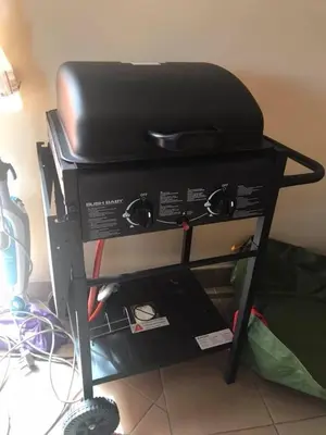 a black chair sitting on top of a machine at Wine Cottage by the Sea in Helderberg
