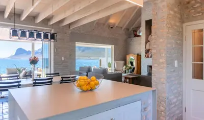 a kitchen with a bowl of fruit on a counter at Pringle Bay Home in Pringle Bay