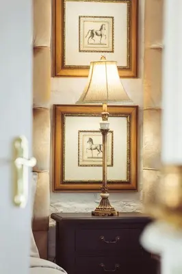 a lamp on a dresser in front of a mirror at Ridgeworth Cottage in Greyton