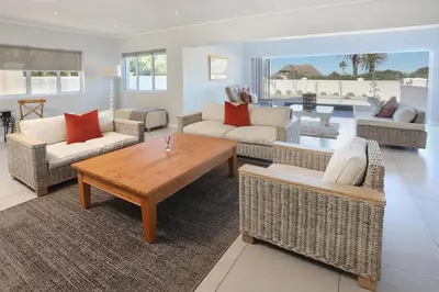 a living room with couches and a coffee table at 269 on Main Holiday Home in Hermanus