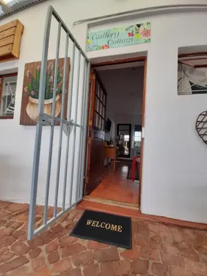a welcome sign in front of a welcome door at Worcester Gallery Cottage in Worcester
