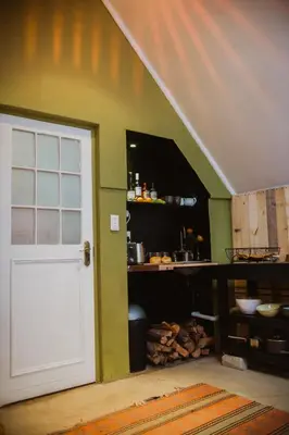 a white door in a room with a kitchen at Southern Yurts in Botrivier