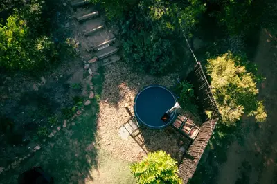 an overhead view of a blue bucket on the ground at Southern Yurts in Botrivier
