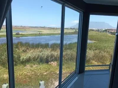 a view of a river from a window at Gaia Hydro-Spa and Guest House in Cape Town