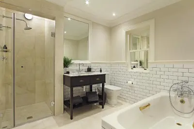 a bathroom with a tub and a sink and a toilet at Stellenbosch Manor in Stellenbosch
