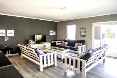 a living room with chairs and a couch at Son & Saffier in Hermanus