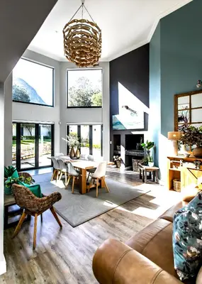 a living room with a table and chairs at Serendipity in Hermanus