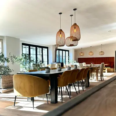 a dining room with a table and chairs at La Paris Estate in Franschhoek