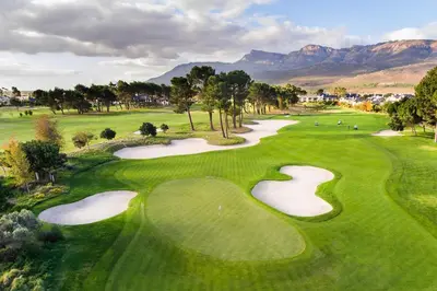 a view of a golf course with mountains in the background at La Paris Estate in Franschhoek