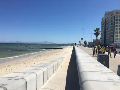 a view of a beach with people walking on it at C-Rus in Strand