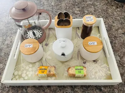 a tray filled with different types of food and appliances at D'urban Ridge Self catering Apartment in Cape Town