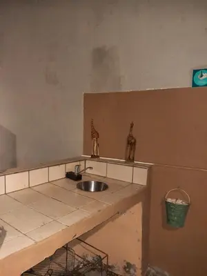 a kitchen with a sink and a counter at TwinnPalms Accommodation in Cape Town