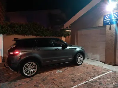 a car parked in a parking lot at night at TwinnPalms Accommodation in Cape Town