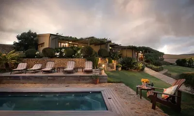 a house with a swimming pool in the yard at Rouxwil Country House in Caledon