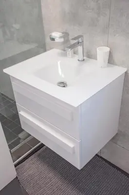 a white sink in a bathroom with a mirror at 9a@Crassula Way in Cape Town
