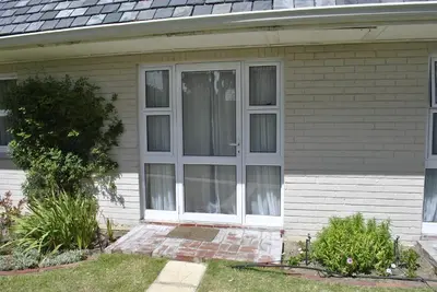 a white door on a house with at Cotswold House Residence in Cape Town